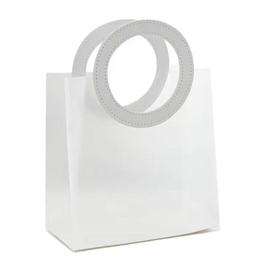 Sac à main transparent élégant avec poignée ronde en cuir coloré, dimensions 18 × 16 × 8 cm