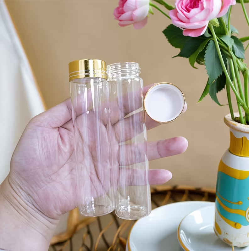 Bouteille en verre transparente de luxe avec bouchon doré 11×3,5 cm